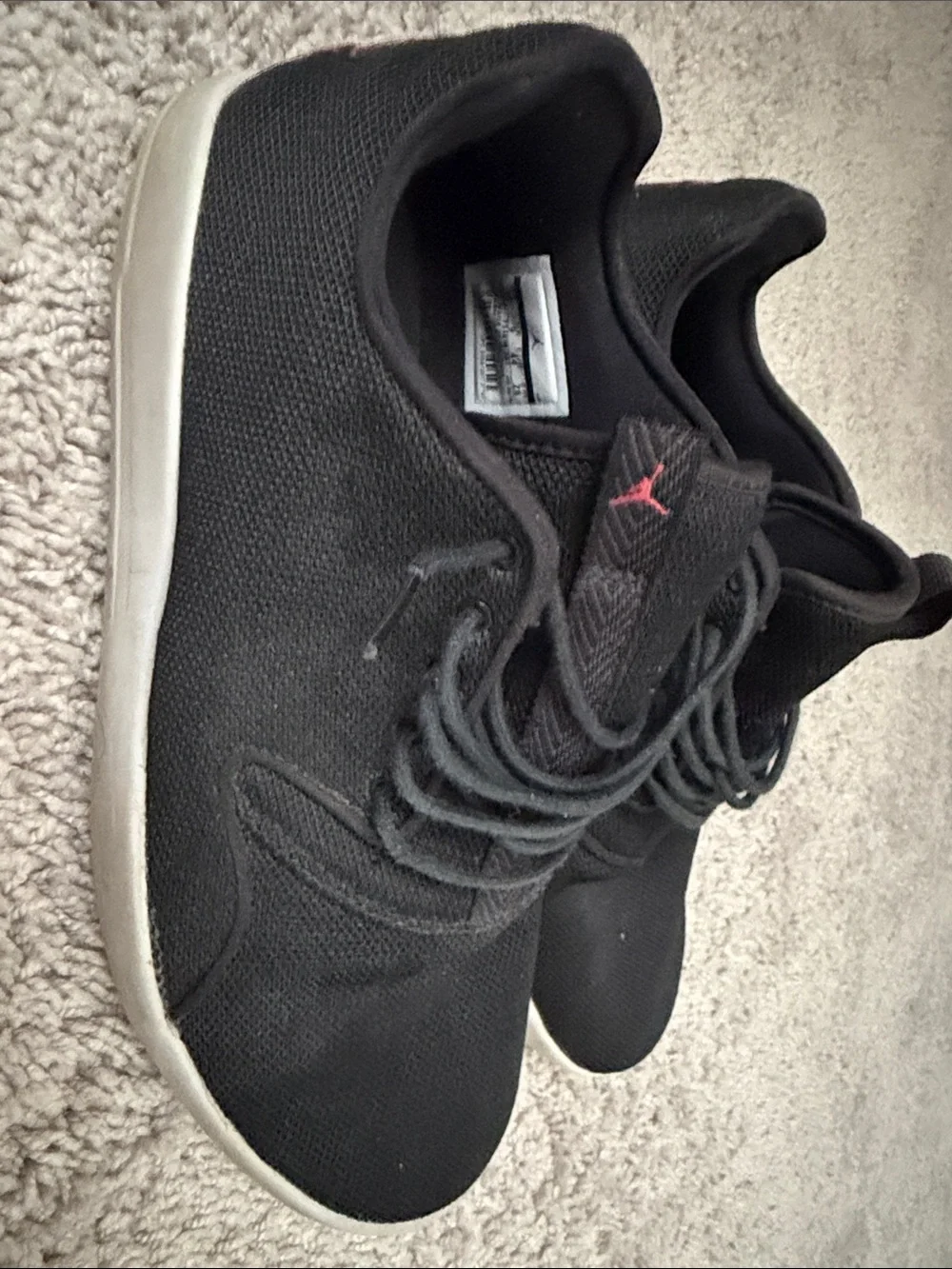 Jordan Men’s Black Sneakers with Red Jumpman Accent
